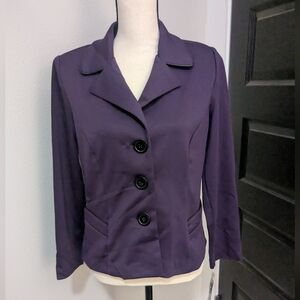 NWT long sleeve purple blazer. Button up front and faux pockets. Washable!